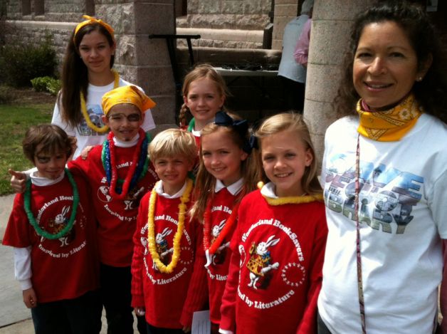 Wonderland Booksavers, with team managers Annabel and Alison Barry, speak at a rally to restore funding to Pequot Library