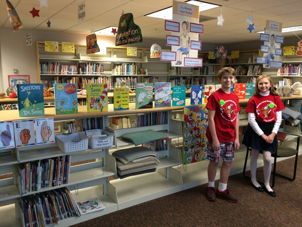 emmaandbrooksposingwithseussbooks