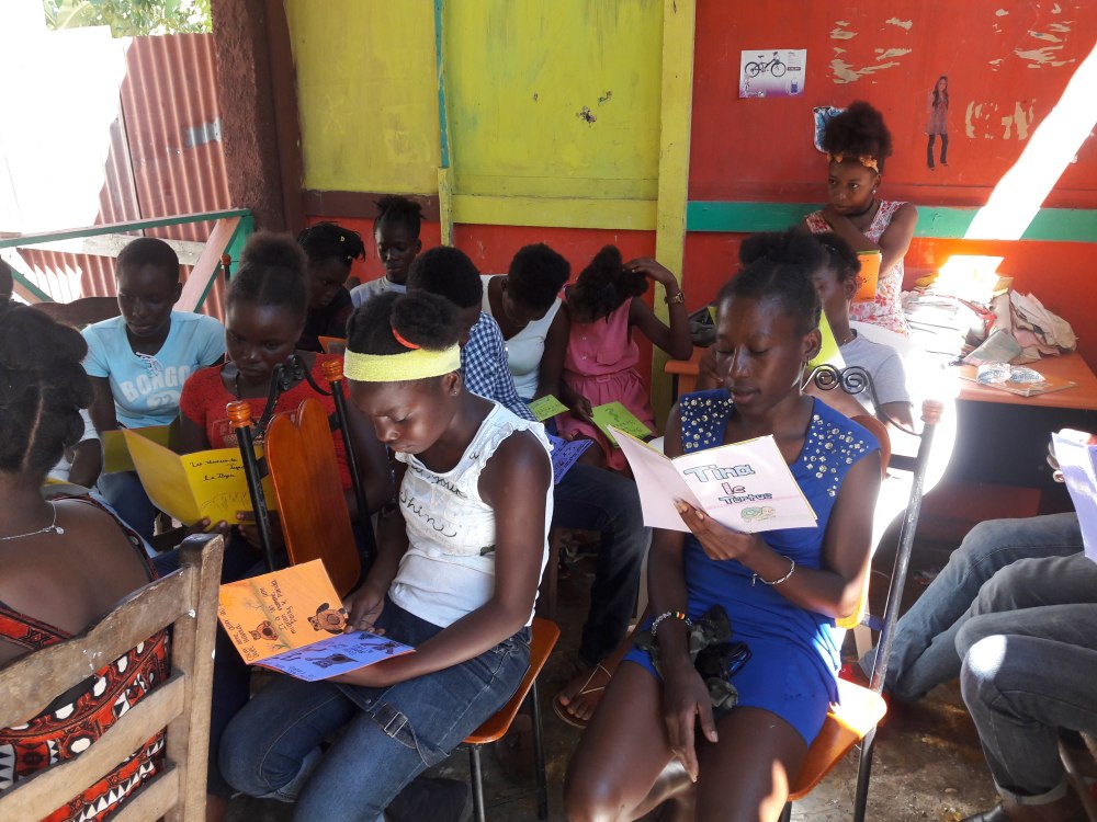 Haitian kids reading books WBS 1