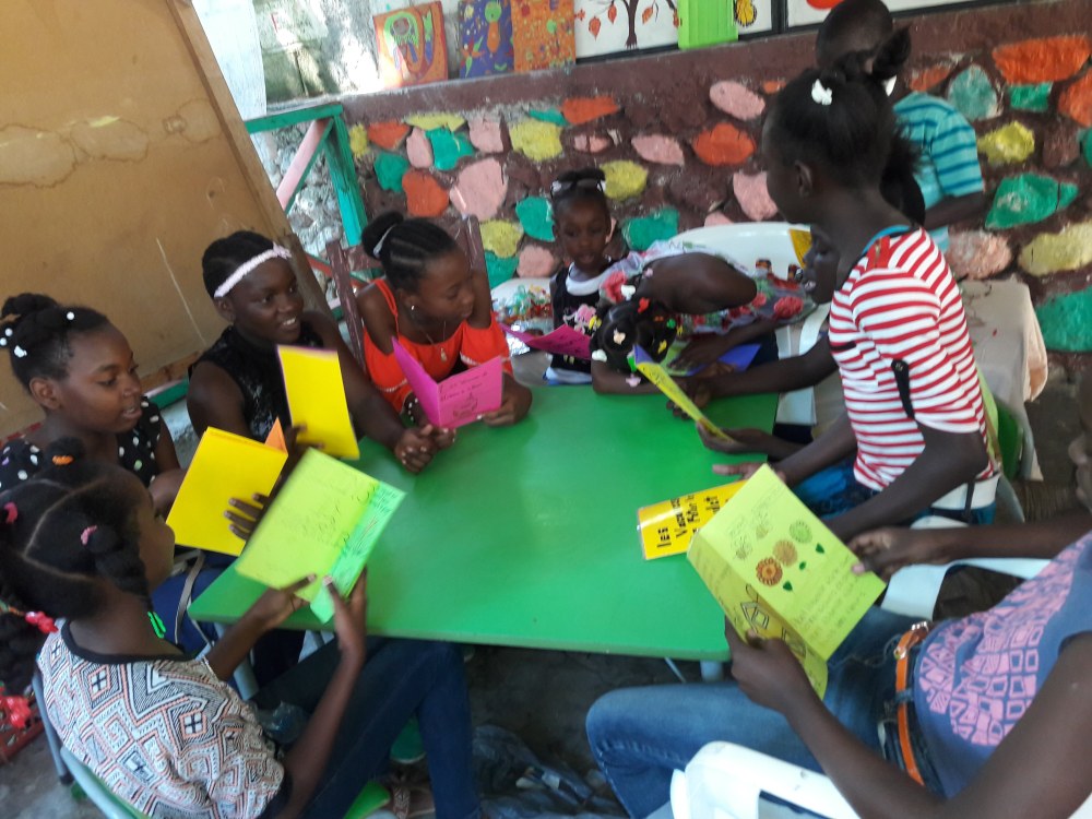 Haitian kids reading books WBS 2