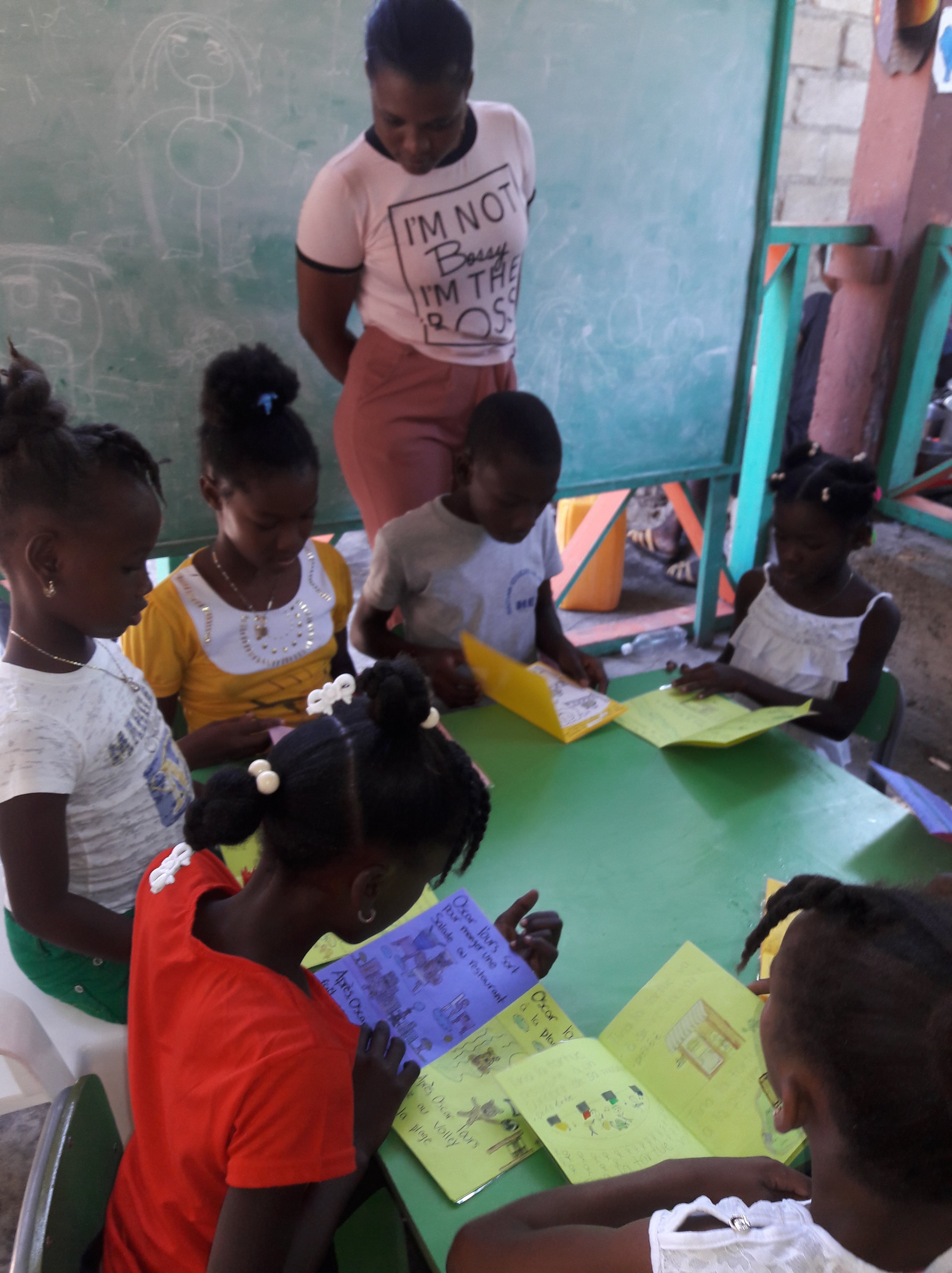 Haitian kids reading books WBS 3