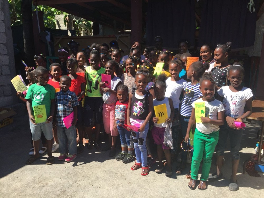 Haitian kids reading books WBS 4